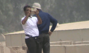 1. Agents photographing and filming Camp Liberty and throwing stones from atop police containers. 2015-09-10